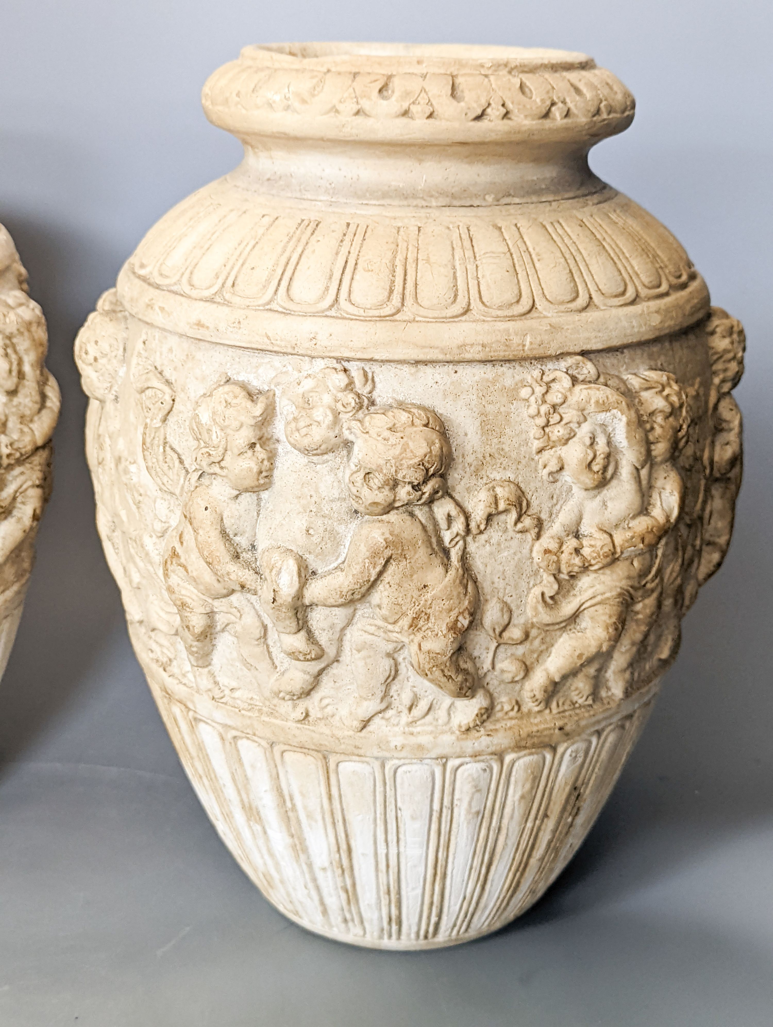 A pair of 19th century earthenware vases moulded in Italian renaissance style 30cm